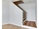 Bright foyer with a staircase featuring wood and white trim at 4049 Dolphin Dr, Tampa, FL 33617
