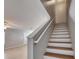 Upstairs staircase with wood and white trim at 4049 Dolphin Dr, Tampa, FL 33617