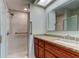 Neutral bathroom with walk-in shower, granite counters and ample lighting at 4908 Lynchburg Ct, New Port Richey, FL 34655