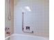 A close-up of a tiled shower-tub combination at 4908 Lynchburg Ct, New Port Richey, FL 34655