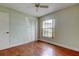Bedroom with hardwood floors, large window and closet at 4908 Lynchburg Ct, New Port Richey, FL 34655