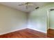 Bright bedroom with hardwood floors and ceiling fan at 4908 Lynchburg Ct, New Port Richey, FL 34655