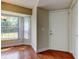 Entryway with wood floors, a front door and a bright window at 4908 Lynchburg Ct, New Port Richey, FL 34655