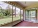 Enclosed lanai offering scenic backyard views and relaxing ambiance at 4908 Lynchburg Ct, New Port Richey, FL 34655