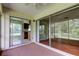 Enclosed lanai with view of yard, kitchen and additional rooms at 4908 Lynchburg Ct, New Port Richey, FL 34655