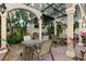 Outdoor common area featuring multiple dining tables and a built-in grilling station at 501 Knights Run Ave # 1310, Tampa, FL 33602