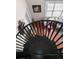 Unique black spiral staircase with wood floors that leads to a bright living area at 501 Knights Run Ave # 1310, Tampa, FL 33602