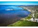 Sprawling aerial view features waterfront living with lush greenery, serene waters, and a coastal neighborhood at 504 S Florida Ave # 225, Tarpon Springs, FL 34689