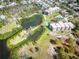 Wonderful overhead view of building and surrounding neighborhood with docks, landscaping and a pool at 504 S Florida Ave # 225, Tarpon Springs, FL 34689