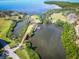 Stunning aerial view of a property with private dock, bridge, and waterfront access to bay and ocean at 504 S Florida Ave # 225, Tarpon Springs, FL 34689