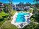 Aerial view of a bright blue swimming pool and meticulously maintained yards of an estate at 504 S Florida Ave # 225, Tarpon Springs, FL 34689