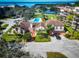 Aerial of a clubhouse and pool area with beautiful landscaping and lovely view at 504 S Florida Ave # 225, Tarpon Springs, FL 34689