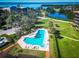A lovely shared pool and lounge area are featured in this aerial view of a building at 504 S Florida Ave # 225, Tarpon Springs, FL 34689