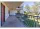 Long balcony with wrought iron railing overlooks manicured lawn and mature trees at 504 S Florida Ave # 225, Tarpon Springs, FL 34689