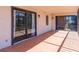 A tiled balcony with multiple sliding glass doors that lead into the interior spaces of the home at 504 S Florida Ave # 225, Tarpon Springs, FL 34689