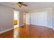 Bedroom featuring a closet and ensuite bathroom with wood floors and neutral colored paint at 504 S Florida Ave # 225, Tarpon Springs, FL 34689