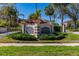 Community entrance with well-maintained landscaping and clear signage for Gulf Front Lagoon at 504 S Florida Ave # 225, Tarpon Springs, FL 34689