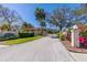 Community entrance showcasing lush landscaping and a welcoming driveway at 504 S Florida Ave # 225, Tarpon Springs, FL 34689