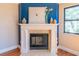 A fireplace features a tiled hearth, wood mantle, and mantel decorations at 504 S Florida Ave # 225, Tarpon Springs, FL 34689