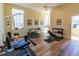 Spacious home gym featuring modern exercise equipment and durable wood flooring for effective workouts at 504 S Florida Ave # 225, Tarpon Springs, FL 34689
