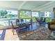 Enclosed lanai featuring tile flooring, dining area and great views of the community pool at 504 S Florida Ave # 225, Tarpon Springs, FL 34689