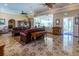 Elegant living room with a chandelier, leather couches, and decorative tile flooring at 504 S Florida Ave # 225, Tarpon Springs, FL 34689