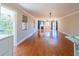Spacious living room with hardwood floors, fireplace, light fixture and a large window at 504 S Florida Ave # 225, Tarpon Springs, FL 34689