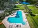 Aerial view of a pristine pool and patio, perfect for relaxation and outdoor enjoyment at 504 S Florida Ave # 225, Tarpon Springs, FL 34689