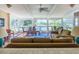 Bright sunroom with pool views, wicker furniture, and tile floors for relaxing and entertaining at 504 S Florida Ave # 225, Tarpon Springs, FL 34689