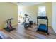 Bright workout room featuring laminated floors, natural light and exercise equipment at 504 S Florida Ave # 225, Tarpon Springs, FL 34689