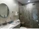 Modern bathroom features a glass shower, vanity, and elegant fixtures at 5144 Pine Tree Ln, Wesley Chapel, FL 33543