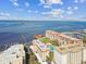 Beautiful condo community with pool, marina, dock, and stunning water views on a sunny day at 620 Edgewater Dr # 204, Dunedin, FL 34698