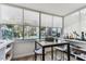 Bright bar area with bar and a window overlooking the community and pool at 620 Edgewater Dr # 204, Dunedin, FL 34698