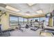 Gym features several cardio machines with scenic views of the surrounding water at 620 Edgewater Dr # 204, Dunedin, FL 34698