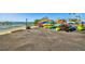 Stacks of colorful kayaks near the water offer recreational opportunities for residents at 620 Edgewater Dr # 204, Dunedin, FL 34698