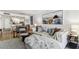 Inviting living room with couch, open to kitchen and dining areas, and hardwood flooring at 620 Edgewater Dr # 204, Dunedin, FL 34698