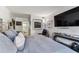 Spacious main bedroom with a large bed, modern furniture, and plenty of natural light at 620 Edgewater Dr # 204, Dunedin, FL 34698
