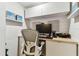 Small work office space with modern gray chair and simple modern design at 620 Edgewater Dr # 204, Dunedin, FL 34698