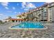 This expansive pool is surrounded by comfortable lounging areas, providing an appealing outdoor living space at 620 Edgewater Dr # 204, Dunedin, FL 34698