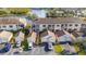 Aerial view of a condo complex with a one-car garage and parking in front of the building at 6311 99Th N Way # 11B, St Petersburg, FL 33708