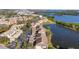 Beautiful aerial view of condo community, lush greenery, and a serene lake at 6311 99Th N Way # 11B, St Petersburg, FL 33708
