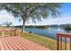 Scenic backyard view featuring wooden deck with waterfront views at 6311 99Th N Way # 11B, St Petersburg, FL 33708