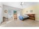Spacious bedroom with natural light, a ceiling fan, and neutral decor at 6311 99Th N Way # 11B, St Petersburg, FL 33708