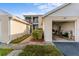 Charming two-story condo with a private one-car garage, lush landscaping, and well-maintained walkways at 6311 99Th N Way # 11B, St Petersburg, FL 33708