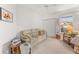 Cozy living room featuring a comfortable couch, wicker side tables, and soft natural light, ideal for relaxation at 6311 99Th N Way # 11B, St Petersburg, FL 33708