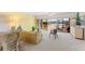 Inviting living room with sliding glass doors to a balcony and serene water views at 6311 99Th N Way # 11B, St Petersburg, FL 33708