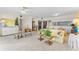 Comfortable living room with an open layout, seamlessly flowing into the dining and kitchen areas at 6311 99Th N Way # 11B, St Petersburg, FL 33708