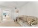 Bright living room with water view, a comfortable couch, and seamless transition to the outdoors for easy relaxation at 6311 99Th N Way # 11B, St Petersburg, FL 33708