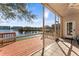 Enjoy the waterfront view from this screened-in patio with a ceiling fan and tile flooring at 6311 99Th N Way # 11B, St Petersburg, FL 33708