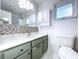 Well-lit bathroom with vanity and light fixtures at 634 Allegheny Dr, Sun City Center, FL 33573